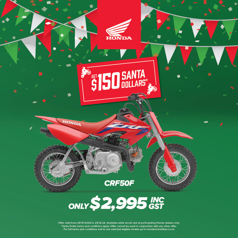 The Honda CRF50F kids bike, featuring a red frame accented with blue and white graphics, sports a small, lightweight build equipped with knobby tires for off-road adventures. The design includes a visible exhaust pipe towards the rear and components like an adjustable throttle, seat, and handlebars tailored for young riders.