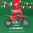 Promotional image for the Honda CRF125F & FB with a $500 discount, featuring a motocross rider performing a trick and the text "Get the next champ started. Score a Jett Pack." Includes an offer for a free Jett Lawrence 2024 sticker kit worth $175 with purchase. Ride like an AMA SX Championship star!