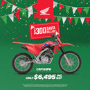 Promotional image for the Honda CRF125F & FB with a $500 discount, featuring a motocross rider performing a trick and the text "Get the next champ started. Score a Jett Pack." Includes an offer for a free Jett Lawrence 2024 sticker kit worth $175 with purchase. Ride like an AMA SX Championship star!