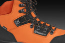 A pair of sturdy, orange and black Husqvarna Protective Leather Boots Technical Light. The boots feature thick rubber soles with deep treads for good traction, metal eyelets, black laces, and reinforced toe caps. One boot stands upright while the other is tilted on its side, reminiscent of rugged motorbike parts.