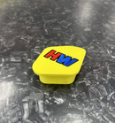 Yellow cap with 'HW' letters on a textured gray surface Map Switch Cover Honda CRF KX 