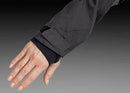 The Husqvarna Xplorer Shell Jacket - Forest Green is showcased on an invisible mannequin. Crafted from water-resistant shell material, this dark green jacket features a hood, zippered chest and side pockets, and eye-catching orange accents. It also proudly displays the Husqvarna logo stitched on both the chest and arm, while adjustable ventilation provides added comfort.