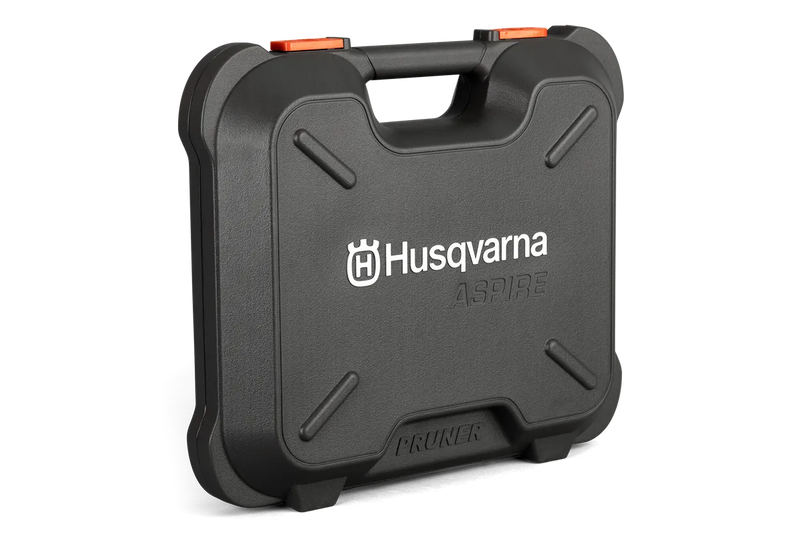 The Husqvarna Aspire™ Pruner Case is a black, hard plastic carrying case adorned with the Husqvarna logo and "ASPIRE" printed in white on the front. Reminiscent of rugged motorbike gear, it includes an ergonomic handle and an orange latch on top, with "PRUNER" embossed at the bottom.