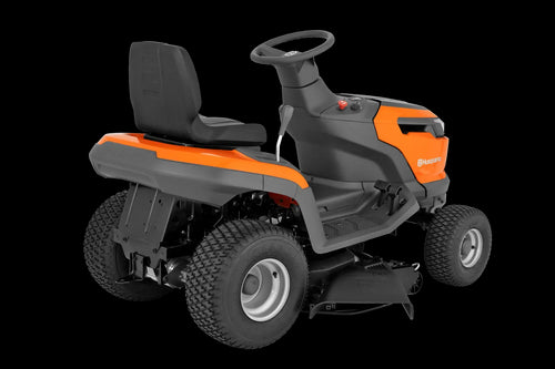The Husqvarna Battery TS 100i Tractor, in orange with a black seat and steering wheel, offers ergonomic comfort and features robust wheels with visible blade housing. The brand logo is prominently displayed on the side, ensuring efficient mowing with every use.