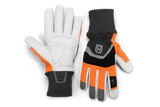 Introducing the Husqvarna Functional Gloves by Husqvarna, a pair of forestry protective work gloves with high-visibility features. These gloves are designed with white palms and a combination of black, gray, and bright orange on the back for maximum visibility. They include ribbed cuffs and prominently display the Husqvarna logo on the wrist area. The design prioritizes durability and ergonomic comfort.