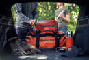 The Husqvarna Xplorer Insulated Bottle - 0,75L features an orange stainless steel body with a shiny silver cup lid and copper vacuum insulation. Its sleek, cylindrical design ensures your beverage stays hot or cold for hours. The versatile cup lid also functions as a drinking vessel, making this bottle perfect for any temperature drink suitable for any adventure.