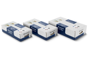 An image of a spool of black loop wire accompanied by several small black plastic stakes and pairs of blue and red connectors scattered nearby on a white background, resembling components from the Husqvarna Automower® Installation Kit by Husqvarna.