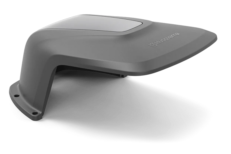 An angled view of a gray protective cover, designed by Husqvarna. The sleek cover appears to be made of durable plastic and has two mounting holes at one end. Perfect for outdoor use, the power of the Husqvarna logo is displayed prominently on the top surface.