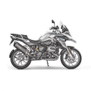 Image of an AKRAPOVIC Slip On Muffler for BMW R1200GS in black and metallic, with carbon fiber tip and bracket. This sleek exhaust system features an elongated cylindrical design, distinctive Akrapovič sound, and a titanium muffler finish.