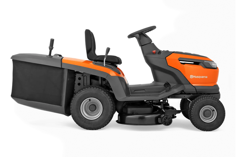 The Husqvarna Battery TC 100i Tractor in bright orange and black features a steering wheel, comfortable seat, efficient collecting system, and durable tires. It boasts sleek lines and a modern design for dynamic mowing.