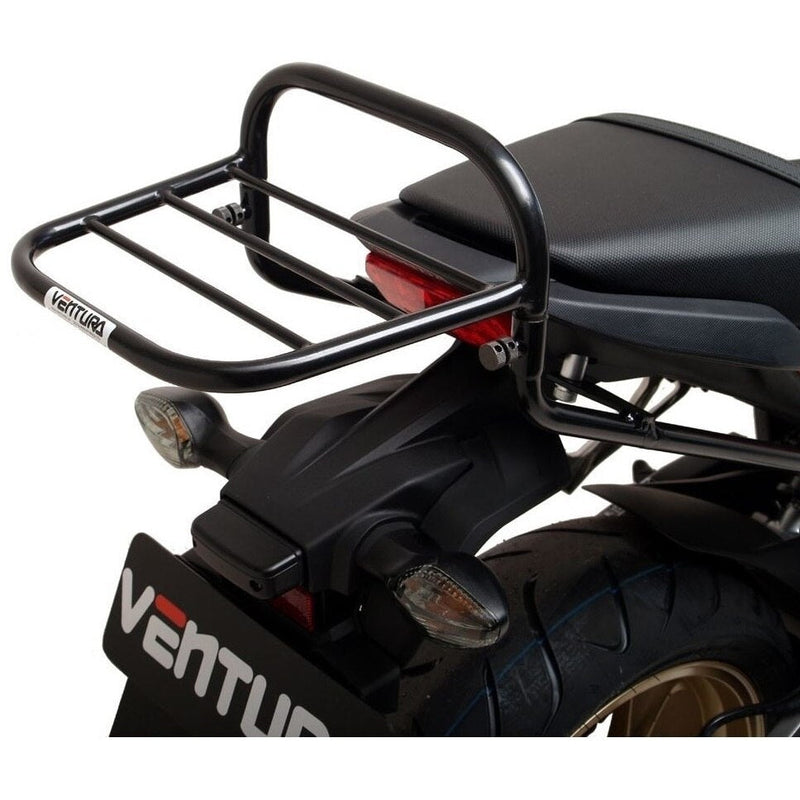The image showcases a Venture EVO-12 Bike-Pack Kit with an Adjustable Pack-Rack and black pack, highlighted by an orange stripe, on a Honda VF 1000 FE, FD. The EVO-Rack is mounted on the motorcycle. The L-Bracket comes with screws and each piece labeled in striking red text.