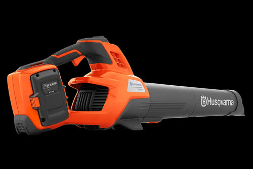 The Husqvarna 230iB Leaf Blower skin, featuring a brushless motor for enhanced efficiency, showcases a sleek orange design with black and gray accents. The "Husqvarna" name is proudly displayed on the tube, and its ergonomic handle ensures comfortable operation.