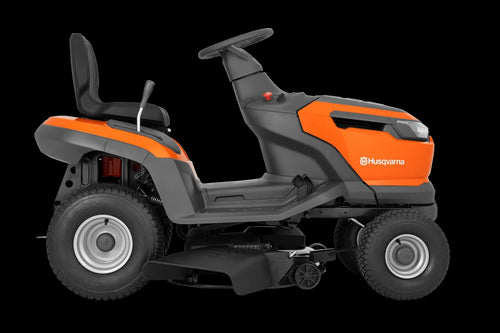 The Husqvarna Battery TS 100i Tractor, in orange with a black seat and steering wheel, offers ergonomic comfort and features robust wheels with visible blade housing. The brand logo is prominently displayed on the side, ensuring efficient mowing with every use.