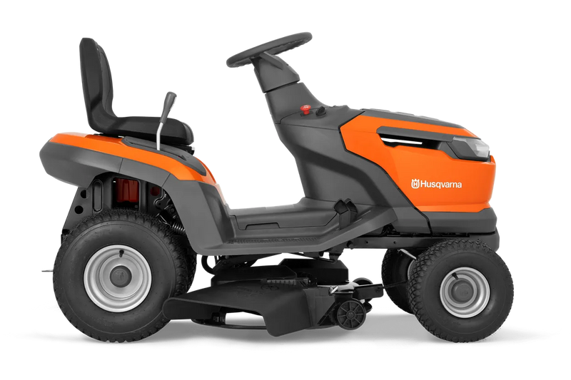 The Husqvarna Battery TS 100i Tractor, in orange with a black seat and steering wheel, offers ergonomic comfort and features robust wheels with visible blade housing. The brand logo is prominently displayed on the side, ensuring efficient mowing with every use.