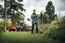 A Husqvarna 325iR Brushcutter (skin) lays on a white background. Perfect for lawns and other outdoor maintenance, the tool features a long silver shaft with a black handle at the top and an orange cutting head at the bottom. The motor is housed in an orange casing near the handle.