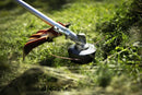 Image of a Husqvarna 325iRJ Brushcutter (skin) ideal for maintaining lawns. The tool features a long handle with a circular black grip near the middle, a power unit at one end, and a trim head with a protective orange cover at the other end. The trimmer is laid on a white background.