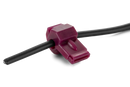 A close-up image of a red Husqvarna Automower® Connector terminal. The terminal, resembling an insulated female disconnect terminal, has a vinyl covering, and its gauge size, "22-16," is visible on the surface. The background is solid black, highlighting the terminal's details.
