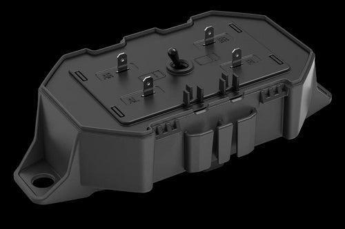 The Husqvarna Automower® Area Switch, enclosed in a gray plastic rectangular casing with a detachable cover, features the Husqvarna logo on top and includes various mounting points and connectors for electronic components. This shell is integral to the Husqvarna Automower, specifically designed to manage the boundary wire and Area Switch configurations.