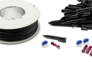 An image of a spool of black loop wire accompanied by several small black plastic stakes and pairs of blue and red connectors scattered nearby on a white background, resembling components from the Husqvarna Automower® Installation Kit by Husqvarna.