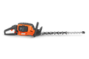 A Husqvarna 522iHDR60 Battery Hedge Trimmer - Skin only with a long blade featuring multiple cutting teeth, perfect for maintaining lawns. The device has a handle with a protective guard, a power button, and ergonomic design for efficient trimming. The Husqvarna brand label is visible on the side of the trimmer, ideal for outdoor use.