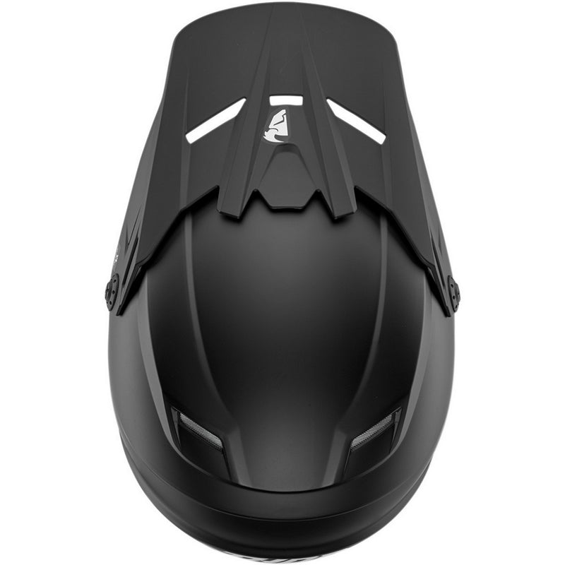 A black THOR MX SECTOR YOUTH HELMET BLACK with a matte finish. Featuring a polycarbonate/ABS shell, this motocross helmet has a visor and prominent chin guard. "Thor" is printed on the side in white letters, and the padded interior, visible through the face opening, includes an EPS liner for added safety. The front has a vent for airflow.