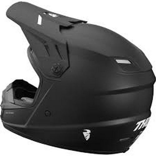 A black THOR MX SECTOR YOUTH HELMET BLACK with a matte finish. Featuring a polycarbonate/ABS shell, this motocross helmet has a visor and prominent chin guard. "Thor" is printed on the side in white letters, and the padded interior, visible through the face opening, includes an EPS liner for added safety. The front has a vent for airflow.