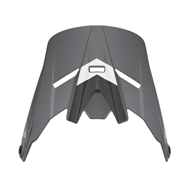 The THOR MX HELMET VISOR KIT S23Y SECTOR YOUTH CHEV GREY BLACK features a sleek, angular, aerodynamic design with dual front ventilation slits. Inspired by the iconic Thor MX style, this youth visor sports a white center accent and rounded side attachment points for secure helmet fitment. A perfect addition to any helmet visor kit.