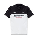 Introducing the Alpinestars Paddock Polo in White/Black by Crown Kiwi Enterprises Limited. This Pique Polo features the Alpinestars HD logo, with a black top half adorned with two logos and a white bottom displaying "alpinestars" and "RACING AHEAD" in bold red lettering.