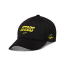 The Alpinestars Angle Velo Tech Hat Black by ALPINESTARS showcases yellow "ASTARS" text and a star-like logo on the front. Crafted from wicking stretch fabric for comfort, it features a silicone transfer logo for style and a Velcro adjuster for fit, with additional side text and graphic detailing.