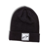 The Alpinestars Women's Delight Beanie in black features a folded brim with a logo woven label on the front. The stylized logo resembles an arrow or comet, making it a trendy and versatile knit jersey accessory against its plain white background.