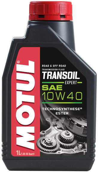 A 1-liter black container of Motul Transoil 10w40 1L with a red cap. Label includes “ROAD & OFF ROAD,” “TECHNOSYNTHESE ESTER,” and an image of engine gears at the bottom. Ideal for gearboxes with integrated wet clutch, the Synthetic Technosynthese® lubricant features prominent red and white "MOTUL".