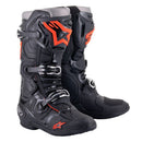 A pair of black and gray Alpinestars Tech-10 MX Boots from Crown Kiwi Enterprises Limited, featuring red accents, multiple buckles, rugged off-road protection including a Dynamic Heel Compression Protector, prominent branding, and a textured sole for superior grip.