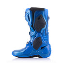 The Alpinestars Tech-10 MX Boots in blue, by ALPINESTARS, feature black and white accents, multiple buckles, protective panels, and a Dynamic Heel Compression Protector. These sturdy yet lightweight off-road riding boots have brand details on the sides and front.