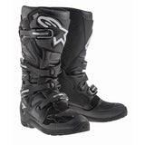 The Alpinestars Tech-7 Enduro Boots in black by Crown Kiwi Enterprises Limited feature a compound sole, multiple buckles, reinforced areas for ankle protection and support, and white logo details, making them ideal for off-road riding.