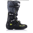 A pair of rugged, high-top black motocross boots with neon green accents. These Alpinestars Tech-5 MX Boots Black/Gray motorcycle accessories feature multiple buckles and straps for secure fastening, a reinforced toe, and a textured design with the ALPINESTARS logo prominently displayed on the front.