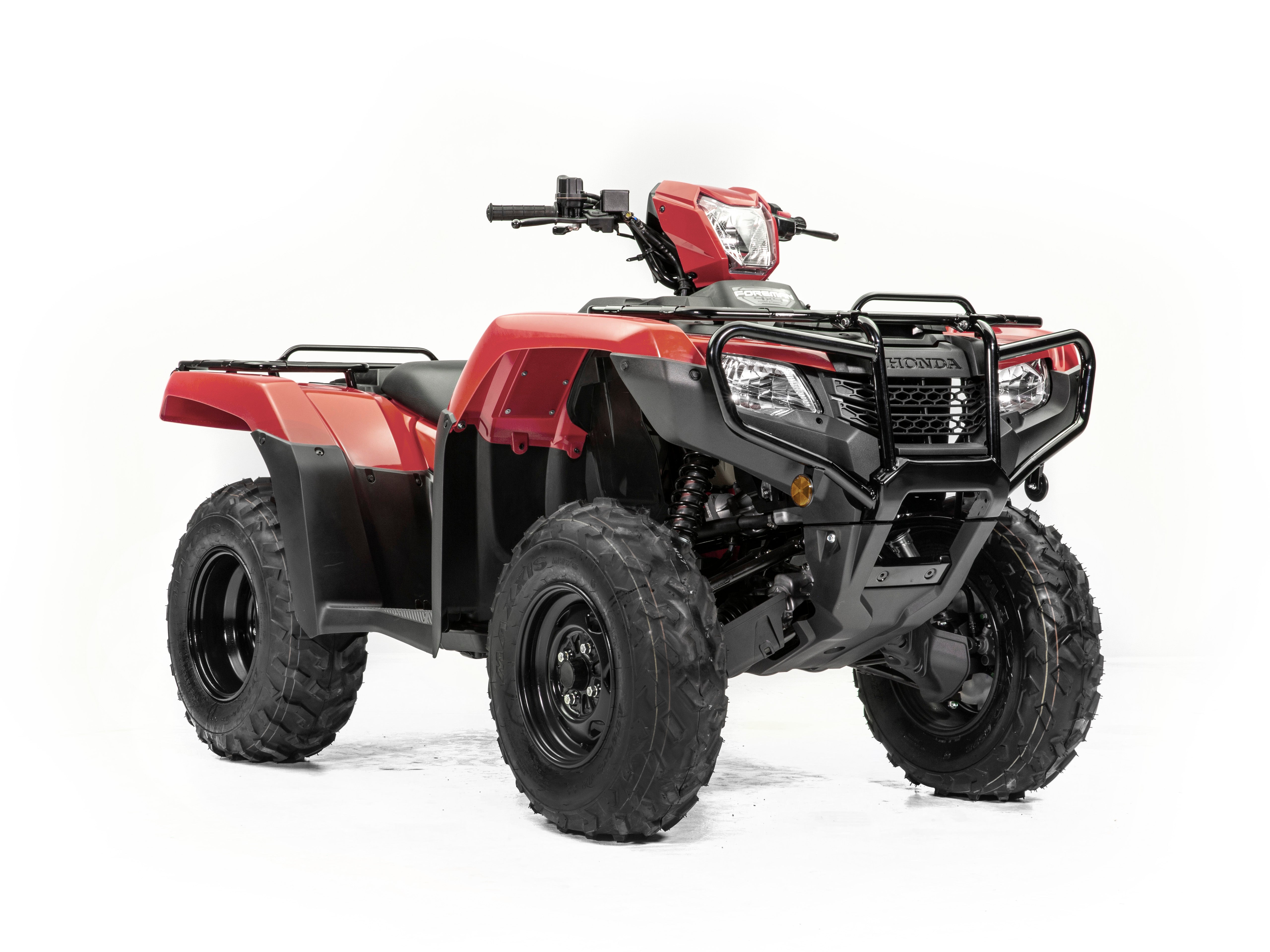 Introducing the Honda TRX520FE2, a red and black all-terrain vehicle (ATV) from the esteemed Honda brand. This robust ATV features durable tires, a protective front bumper, and a sturdy frame, making it perfect for your next adventure. Designed specifically for off-road use, it includes handlebars for precise steering and seating tailored for one rider. The white background accentuates the intricate details of this impressive vehicle.