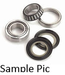 Various types of bearings and seals are arranged in a group. There are two metal bearings—one with a tapered roller design and one cylindrical—typical of the STEERING HEAD BEARING KIT ALL BALLS KAWASAKI by VERTEX, intended for a Suzuki DR650 or Kawasaki KLX400, along with two rubber oil seals. The text 'Sample Pic' is displayed at the bottom of the image.