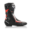 The Alpinestars S-MX Plus v2 Boots by Crown Kiwi Enterprises Limited feature a sleek black/white design. They offer reinforced ankle protection, textured soles for grip, and incorporate the Multi-Link Control (MLC) system for enhanced riding stability.