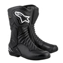 Alpinestars SMX-6 V2 Gore-Tex Boots by Crown Kiwi Enterprises Limited are black motorcycle boots with reinforced panels, a side logo, GORE-TEX liner for waterproofing, textured stitching, and ankle brace protection. These stylish boots offer safety and a sleek appearance.