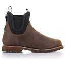 The Alpinestars Turnstone Shoes by Crown Kiwi Enterprises Limited are a stylish pair of brown bovine leather pull-on Chelsea boots, featuring black elastic side panels and sturdy rubber soles. Designed with a round toe and pull tabs for easy wear, these protective riding shoes are elegantly displayed on a white background.
