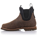 The Alpinestars Turnstone Shoes by Crown Kiwi Enterprises Limited are a stylish pair of brown bovine leather pull-on Chelsea boots, featuring black elastic side panels and sturdy rubber soles. Designed with a round toe and pull tabs for easy wear, these protective riding shoes are elegantly displayed on a white background.