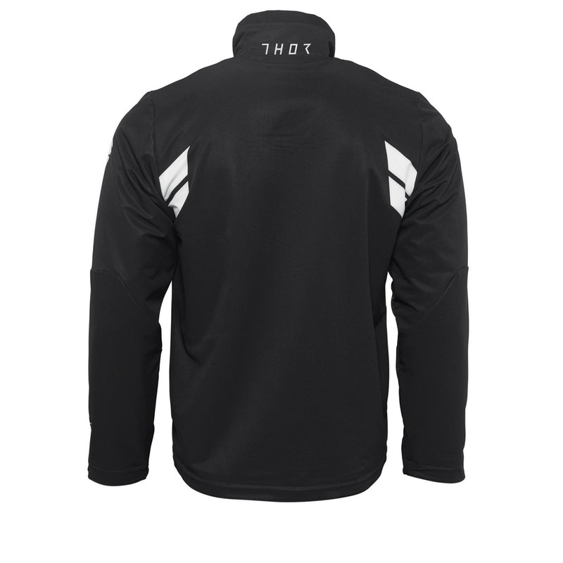 Introducing the THOR WARMUP JACKET BLACK/WHITE by THOR MX: This athletic black jacket features a zippered front, a high collar, and prominently displays the word “THOR” in bold white block letters across the chest. The sleeves boast white accents along with additional text. As part of the Warm Up collection, this jacket also includes practical front pockets and small logos near the collar and shoulders.