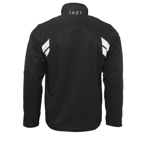 Introducing the THOR WARMUP JACKET BLACK/WHITE by THOR MX: This athletic black jacket features a zippered front, a high collar, and prominently displays the word “THOR” in bold white block letters across the chest. The sleeves boast white accents along with additional text. As part of the Warm Up collection, this jacket also includes practical front pockets and small logos near the collar and shoulders.