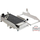 Two silver metal brackets stand upright, each featuring a rectangular frame with several cutouts and holes for mounting purposes. These *RADIATOR BRACE CROSSPRO SILVER SUZUKI RMZ250 10-18 appear designed for supporting or securing equipment, making them ideal for Suzuki RM-Z 250 radiator protection.