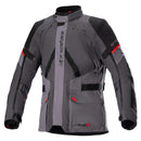 The Alpinestars Monteira Drystar XF Jacket by Crown Kiwi Enterprises Limited is a motorcycle jacket in gray and black with red accents, offering all-weather protection through its multiple pockets, adjustable straps, and zippers. Its design features reinforced panels and prominent branding on the chest and arm, making it ideal for adventure touring.