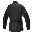 The Alpinestars Stella Gravity Drystar Jacket by Crown Kiwi Enterprises Limited is a black motorcycle jacket featuring long sleeves, a high collar, and multiple zippered pockets. It provides impact protection with padded shoulders and elbows and includes adjustable side straps for a comfortable fit. The weather-resistant fabric ensures it is both waterproof and durable.