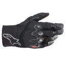 The Alpinestars Hyde XT Drystar XF Gloves by Crown Kiwi Enterprises Limited are sleek black motorcycle gloves with knuckle protection, impact safety, a textured palm grip, and waterproof performance. They feature a stylish wrist logo for an ultimate ride.