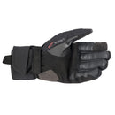 The Alpinestars Bogota Drystar XF Gloves by ALPINESTARS are black motorcycle gloves featuring protective armor and a ribbed backhand design. They offer waterproof performance with reinforced knuckles, a small red wrist accent, and the stylish Alpinestars logo on the cuff.