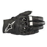 The Alpinestars Celer V2 Gloves Black, a premium road riding glove by ALPINESTARS, features black perforated leather with a wrist logo. It has vented hard knuckle protection and white finger accents, positioned palm down.