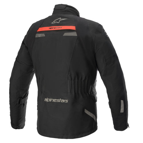 The Alpinestars Altamira Gore-Tex Jacket by ALPINESTARS is a black motorcycle jacket with gray accents and red detailing on the pockets and arms. It features adjustable straps, PrimaLoft Insulation for warmth, multiple pockets, and branding on the chest and arm, focusing on durability and functionality.